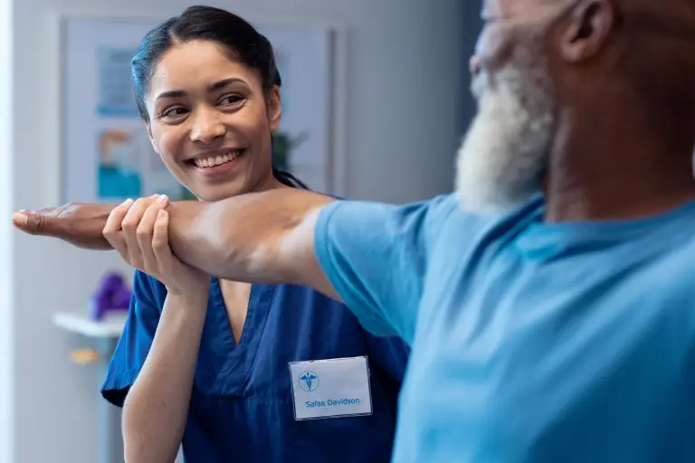 Nurse helping patient stretch