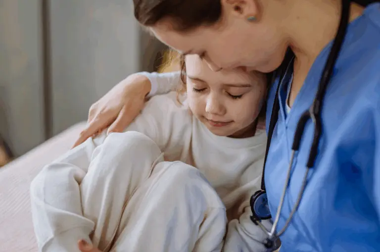 a nurse comforting a child