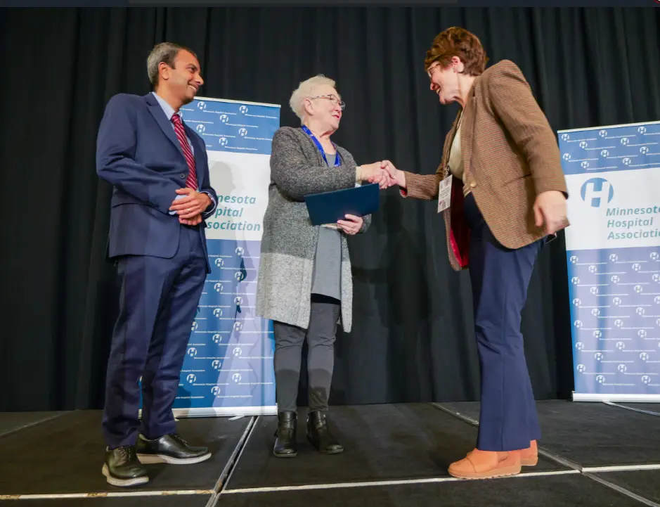 A trustee is presented their MHA certification