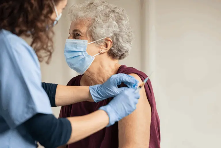 an elderly patient receiving a vaccine
