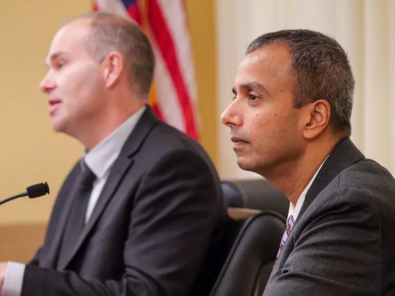 two men testifying at the MN legislature