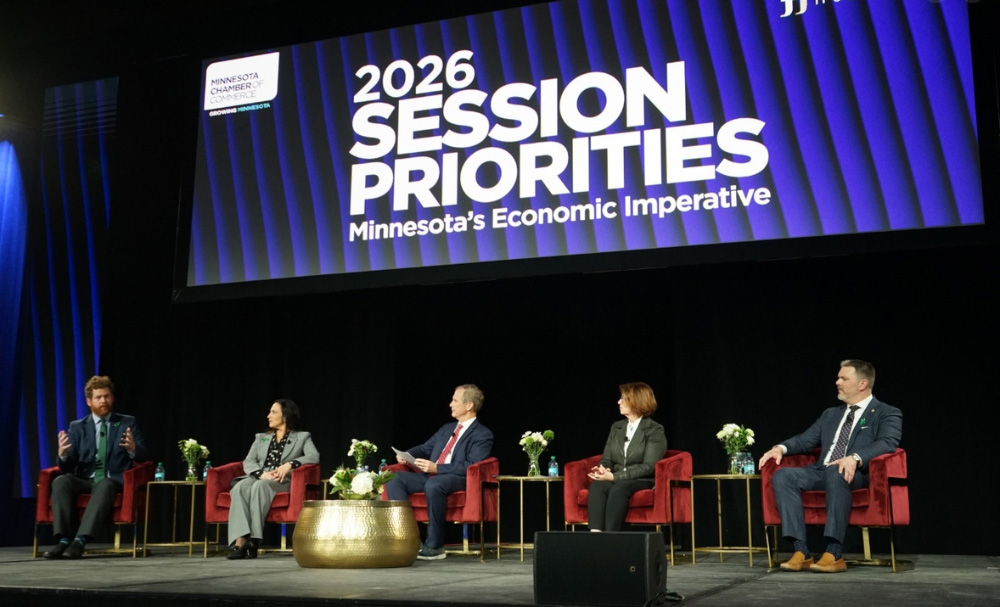 four panelists in front of a screen that says "2026 Session Priorities"