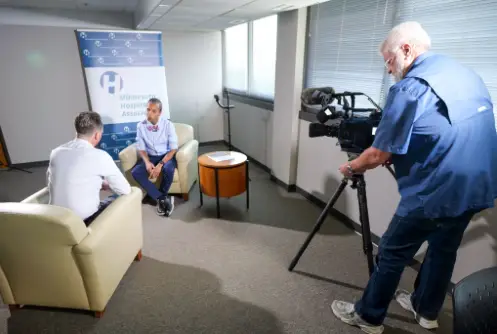 two people being recorded for a news interview