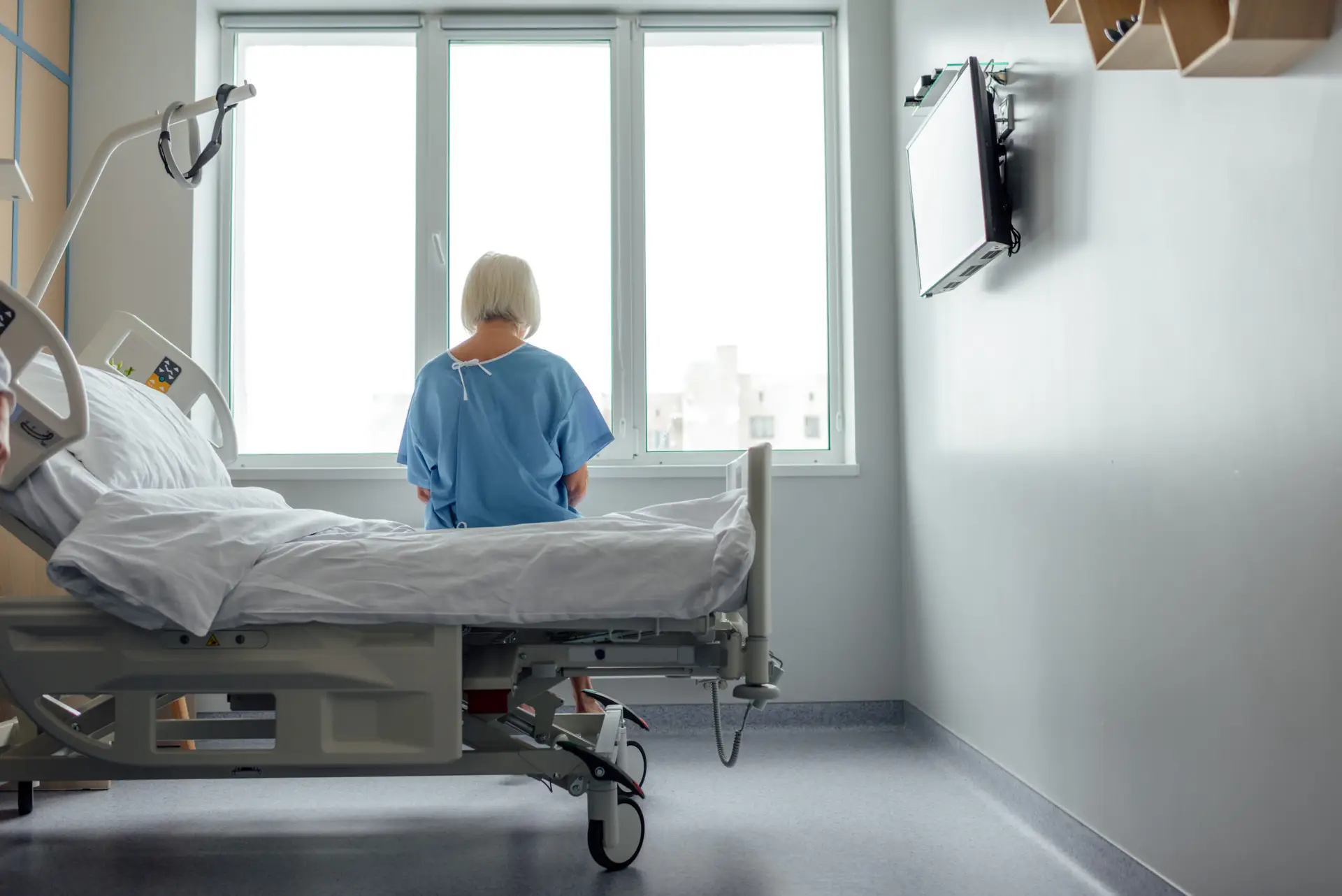 a patient sitting on a hospital bed