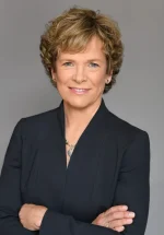 A professional headshot of a woman