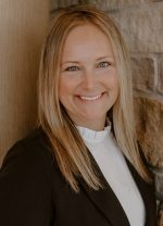 A professional headshot of a woman