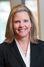 A professional headshot of a woman