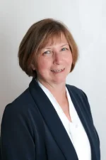 A professional headshot of a woman