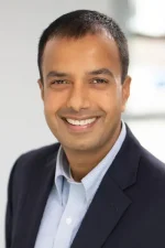 A professional headshot of a man